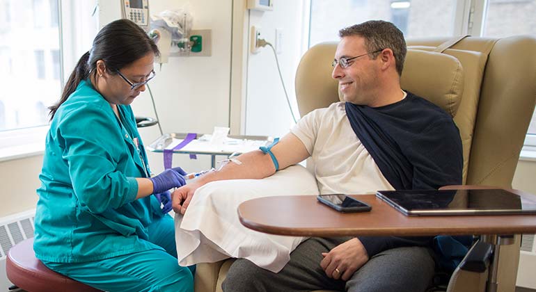 nurse injecting a patient