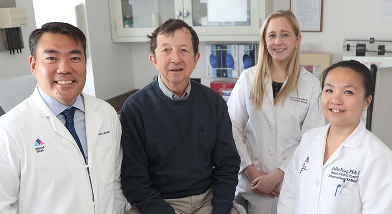 patient surrounded by his doctors