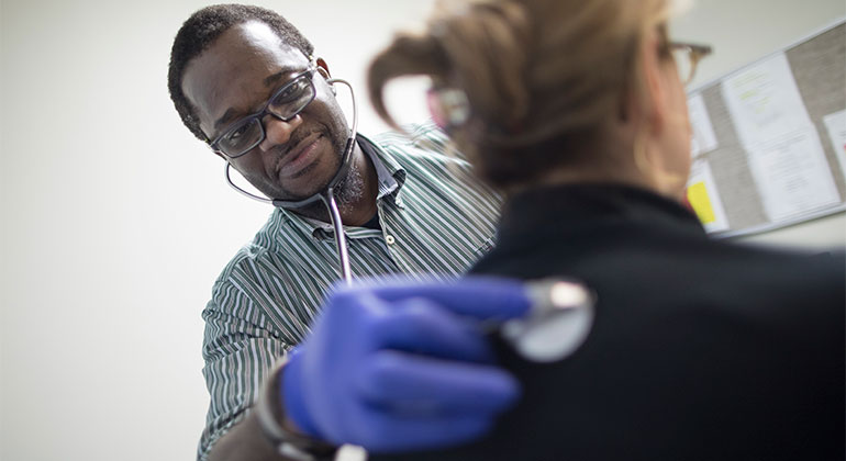 Image of doctor examining patient