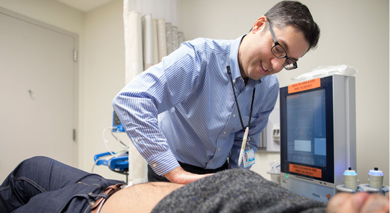 Image of doctor examining patient