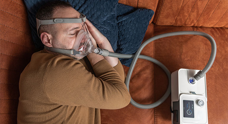 patient using CPAP machine during sleep