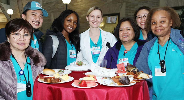 a group of medical professionals at breakfast