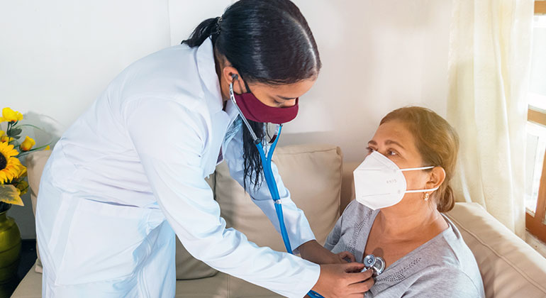 doctor checking patient