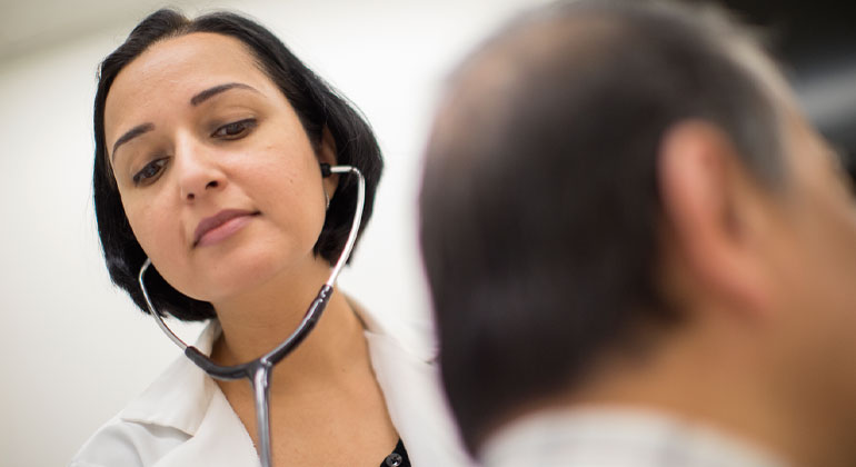 Doctor listening to patient