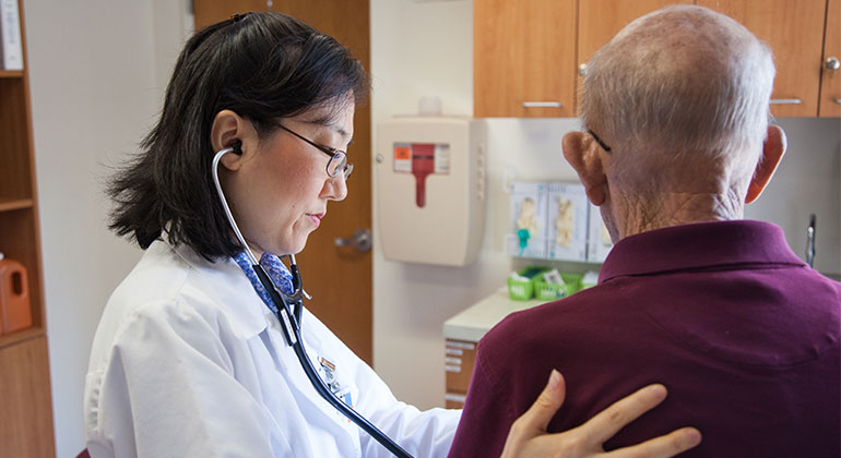 Doctor listening to patient