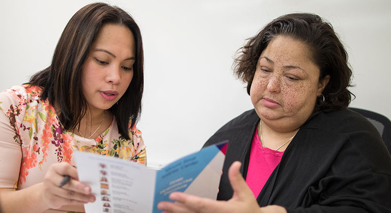 Doctor reviewing pamphlet with patient
