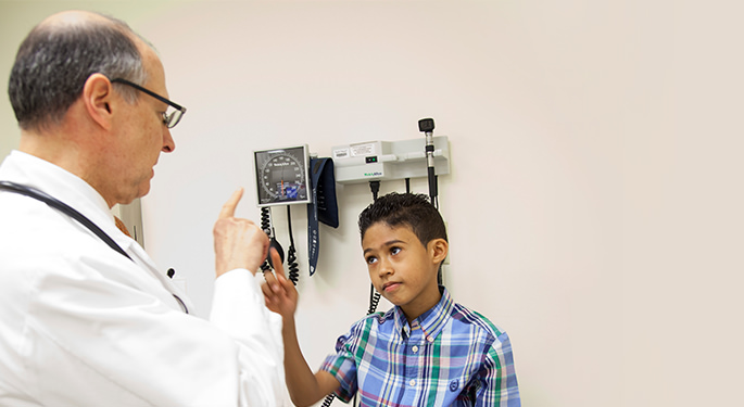 Doctor diagnosing child in Pediatric Movement Disorder