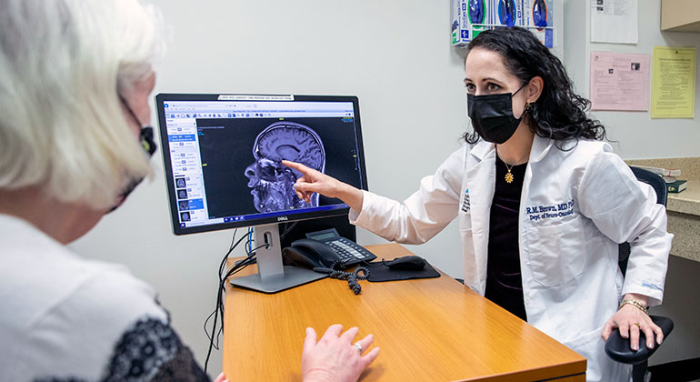 doctor showing MRI to patient