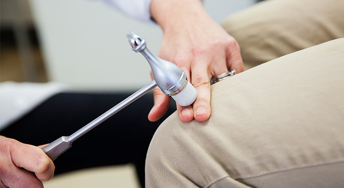 physician using a reflex hammer