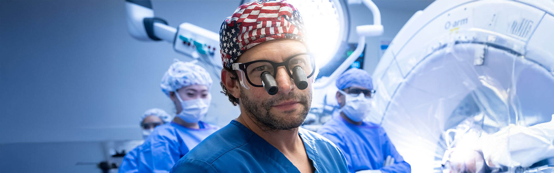 neurosurgeon with team and patient in background