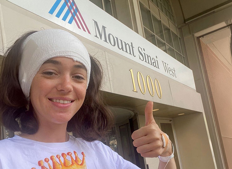Photo of epilepsy patient giving a thumbs up after procedure