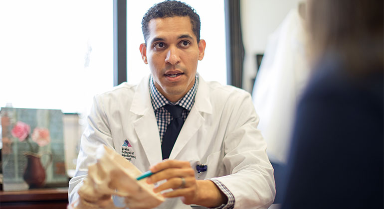 Doctor with model skull