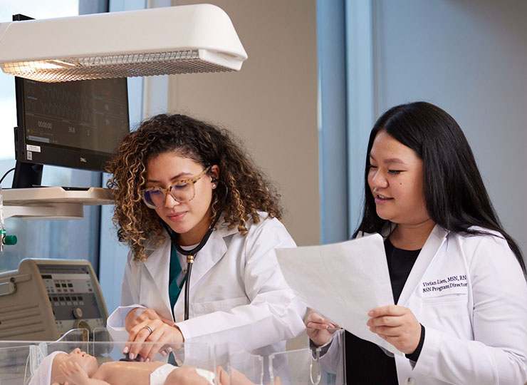 Photo of Nursing students working in simulation lab