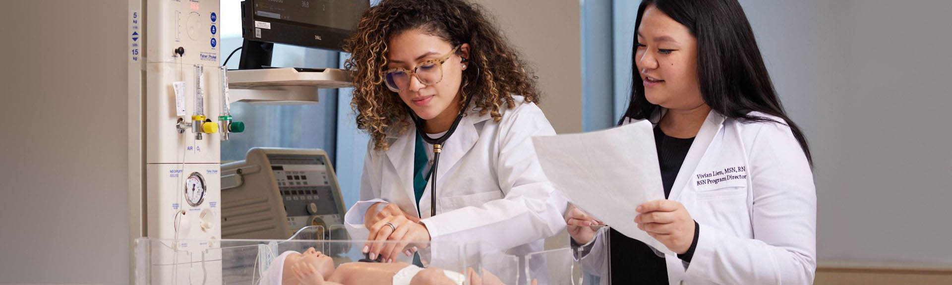 Nursing students working in simulation lab