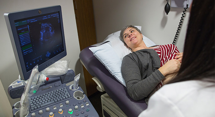 patient looking at sonogram