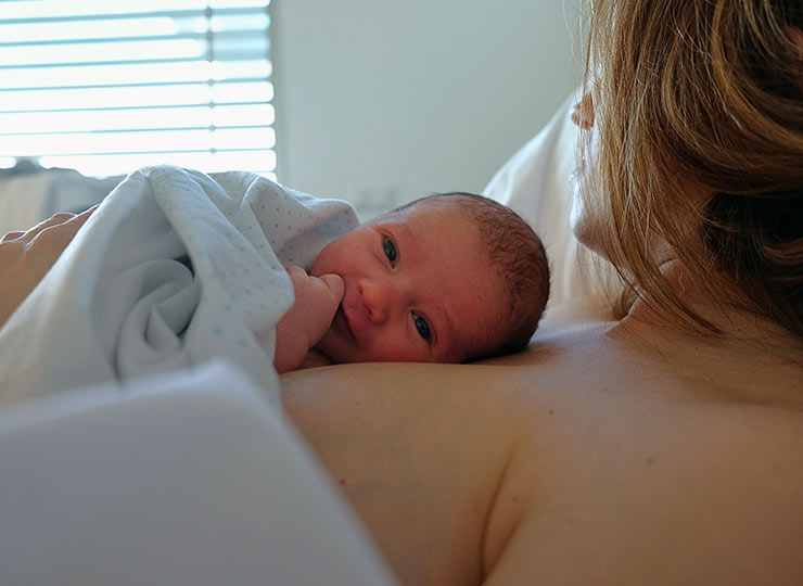 Photo of Mother holding baby