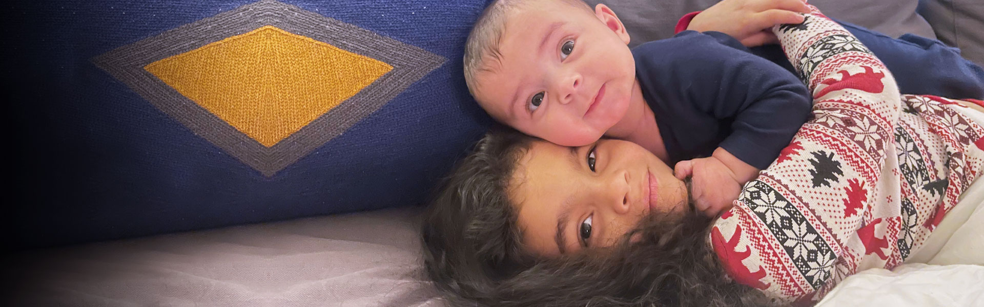 sister holding baby brother