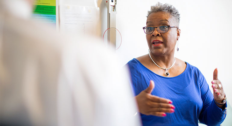 Image of female patient talking to doctor