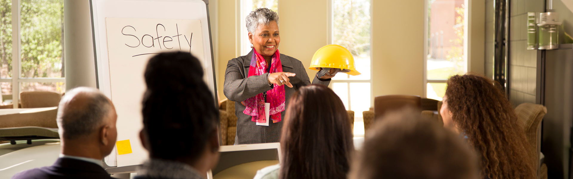Image of woman talking to group of people