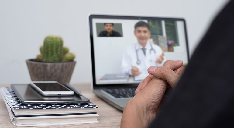 individual in teleconference with doctor
