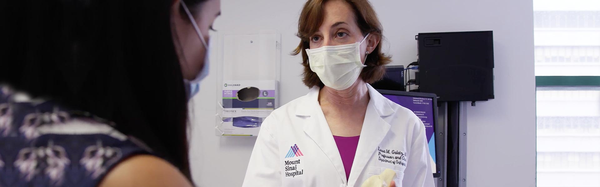 Image of doctor wearing a mask