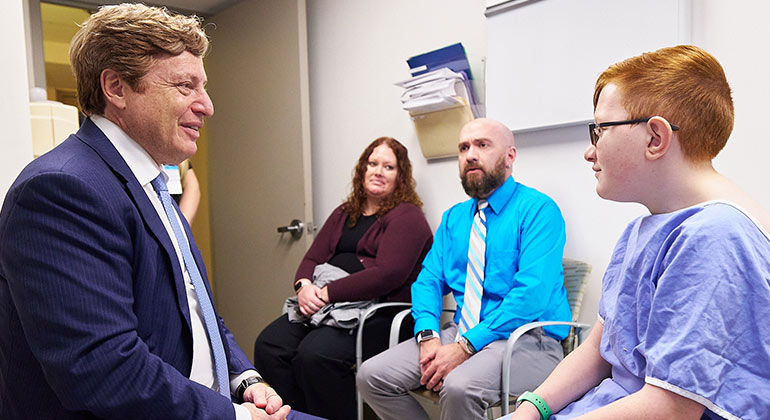 doctor talking to pediatrics patient and parents