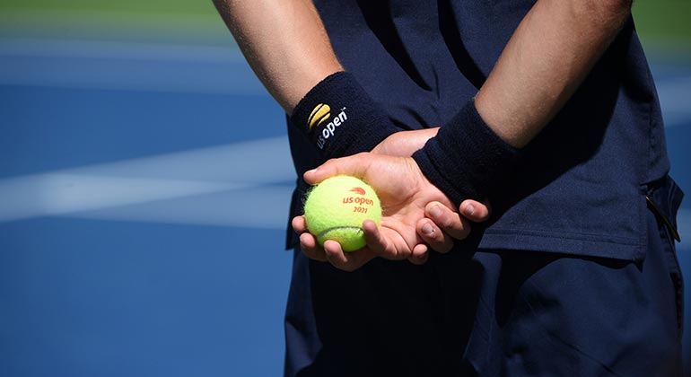 Player holding tennis ball