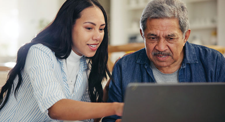 people looking at computer monitor