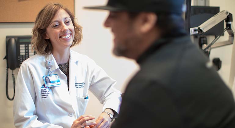 Close up of a female doctor chatting with a male patient