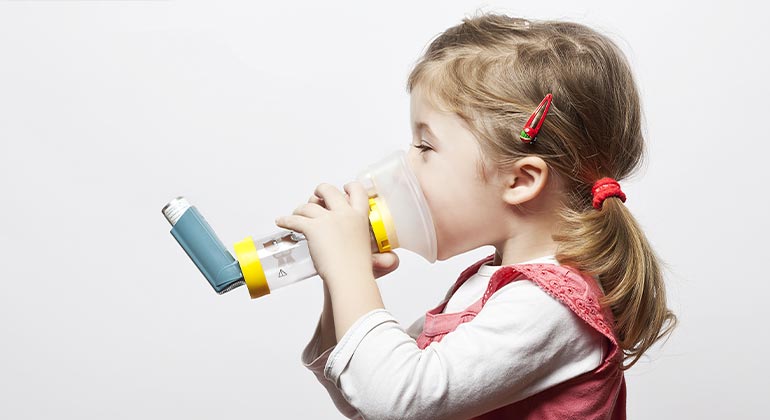 child receiving asthma treatment