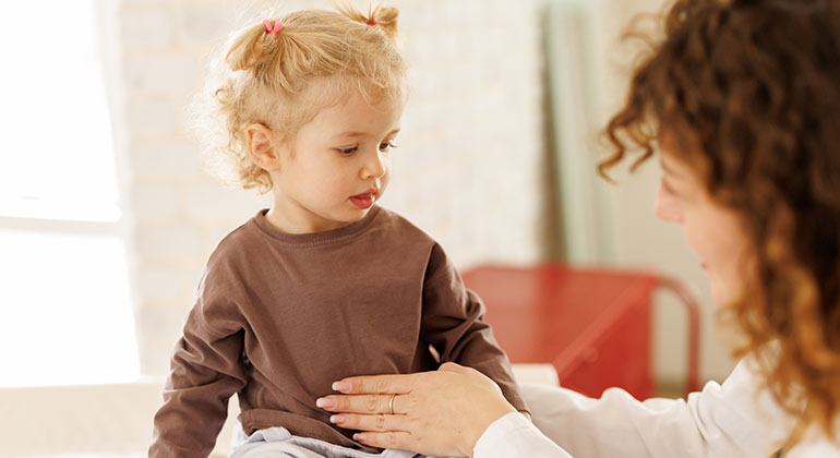 pediatrician examining child patient