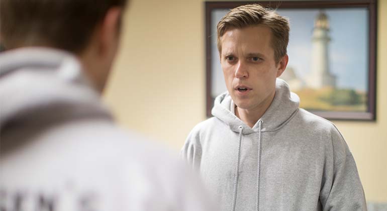 two men in sweatshirts
