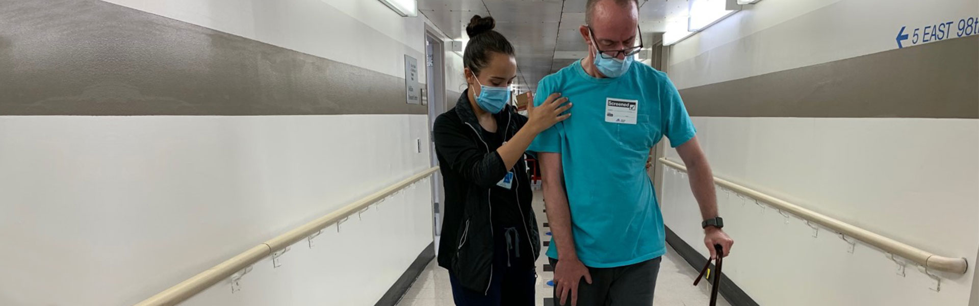 image of therapist assisting patient