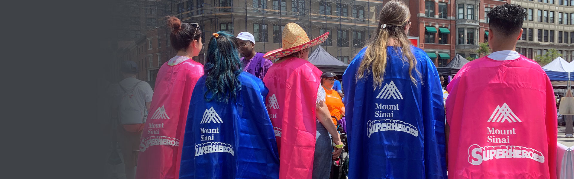 Group of people wearing superheroe capes