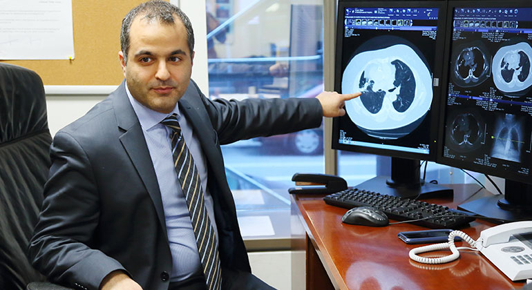 Image of doctor in front of computer screen