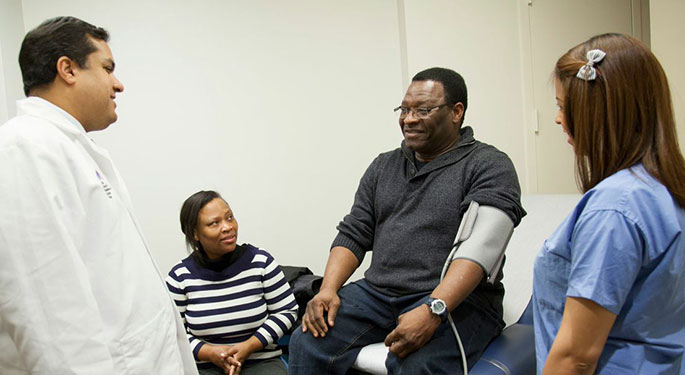 Dr. Badani with patient and his family