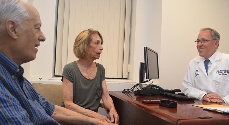 Image of doctor talking to patients