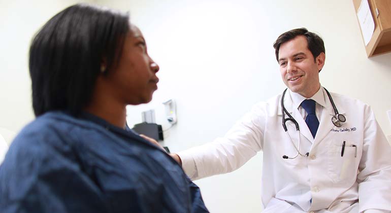 Doctor touching patient