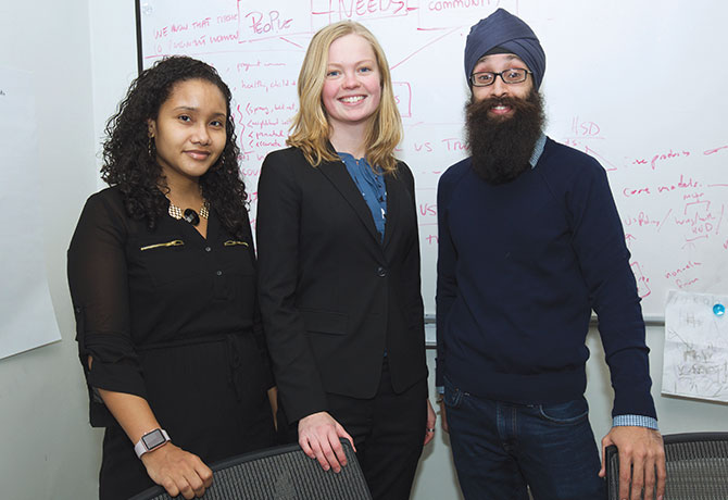 A photo of Prabhjot Singh, MD, PhD, with Hilda Mejias, a Health Coach in Harlem; and Anna Stapleton, Program Manager for Policy at The Arnhold Institute for Global Health.