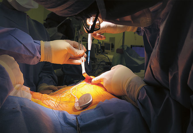 Image of doctors performing surgery on patient
