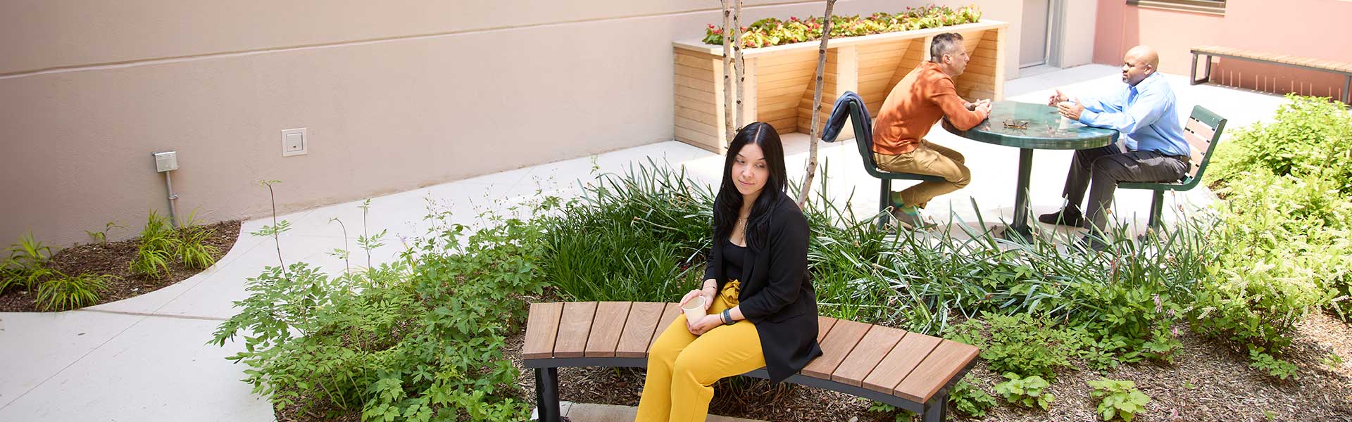 image of person sitting on a bench outside