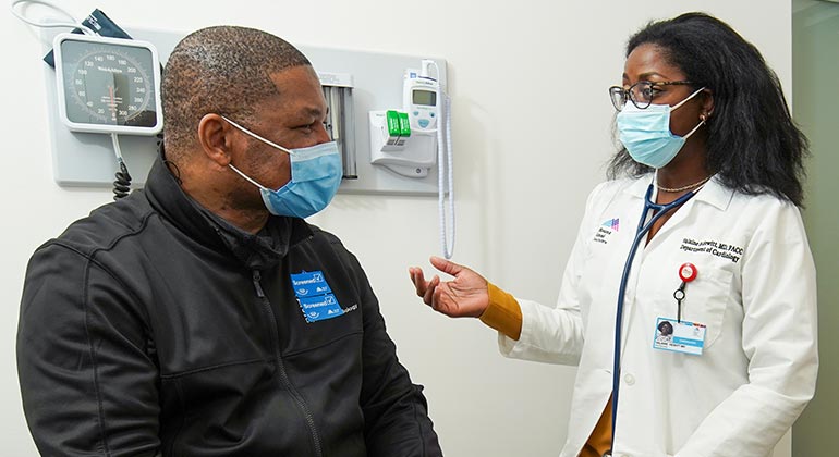 Masked doctor and patient