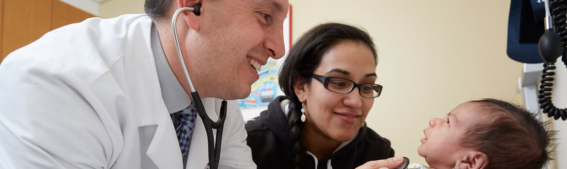 Doctor examining baby