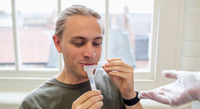 patient taking saliva test