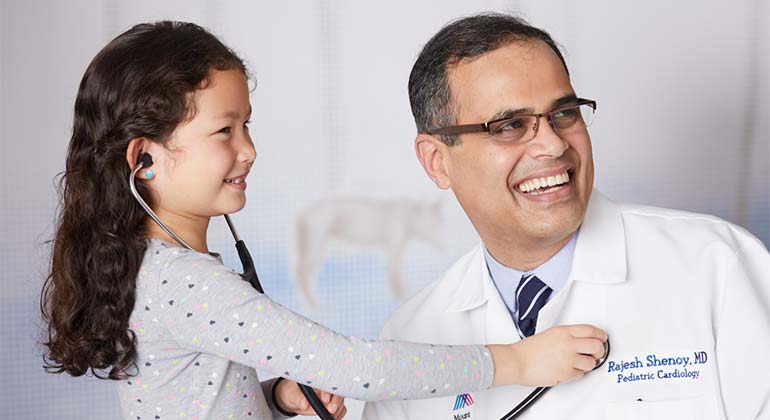 image of doctor and little girl