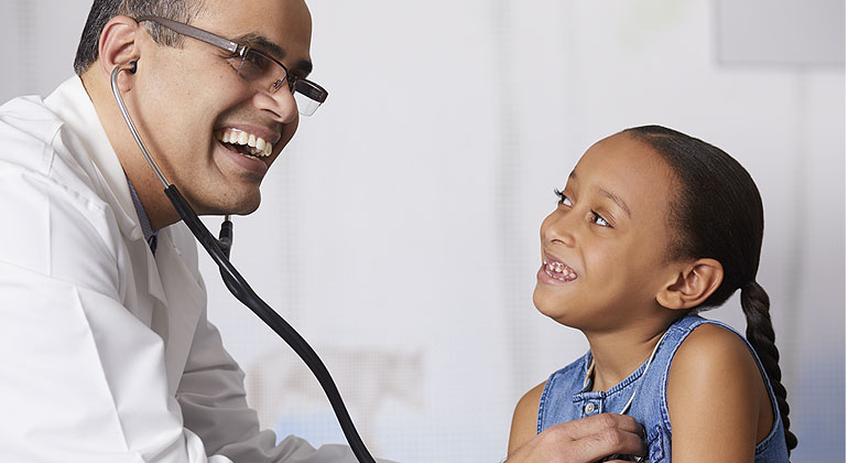 Image of doctor examining girl