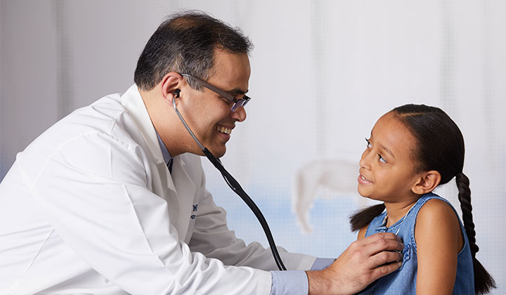 Doctor and little girl with Heart Murmur