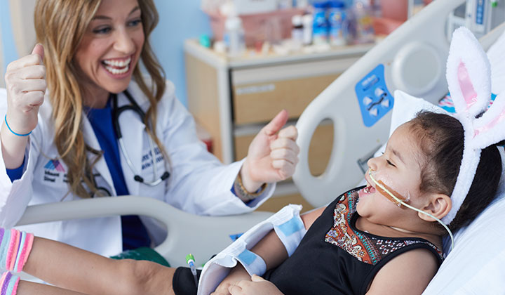 Doctor and little girl cheering