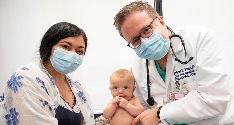 Image of doctor and mother holding baby