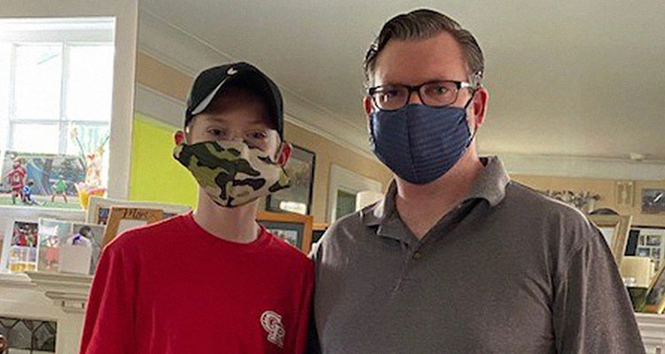 Image of father and son wearing masks